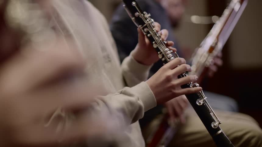 Musicians playing instruments together during practice