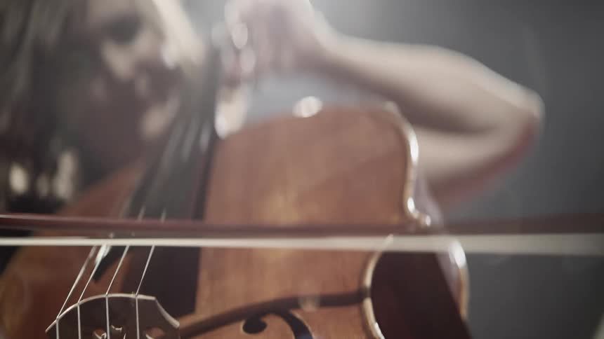 A woman plays a cello