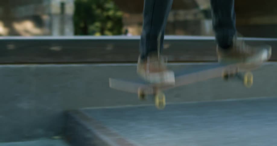 Young man jumping with a skateboard on a skate park