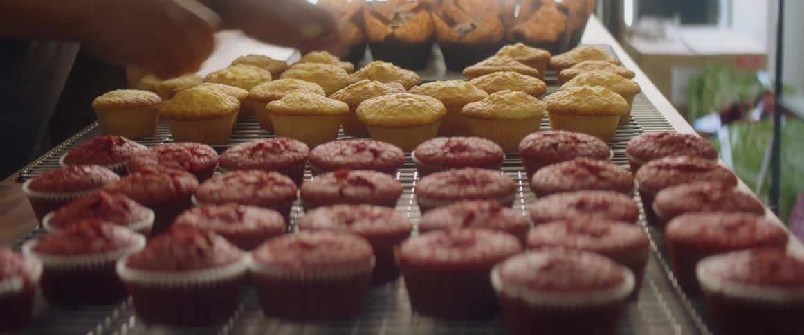 Person making cup cakes
