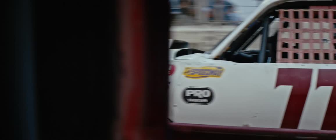 A view of a race car driving on a track