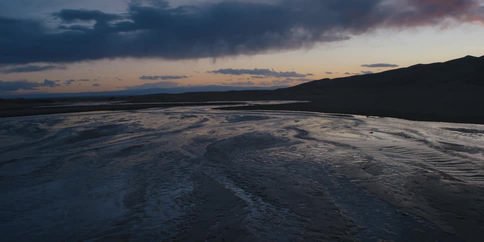 A view of a landscape with clouds in the distance