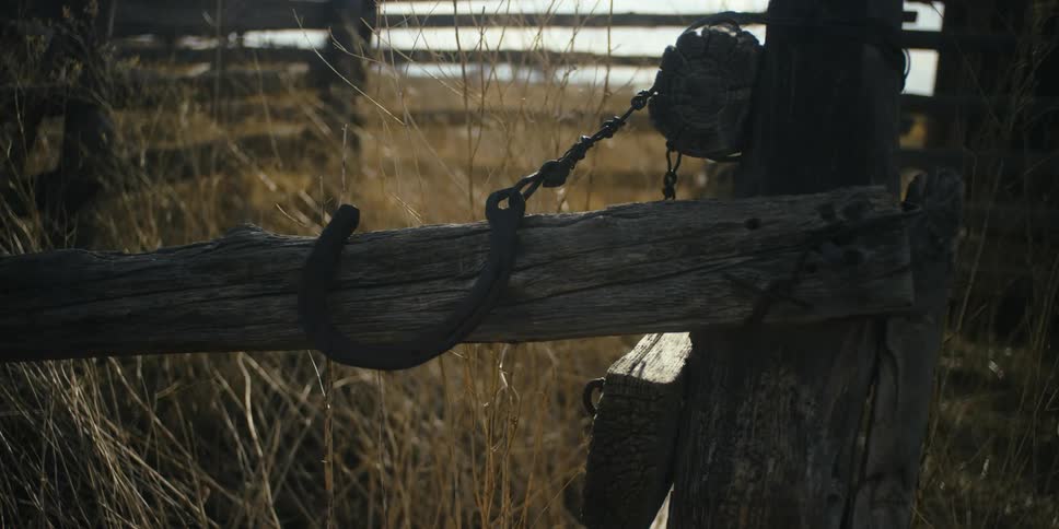 A horseshoe attached to a fence