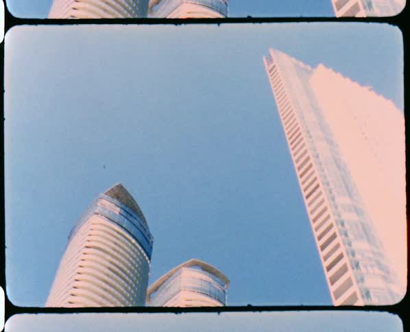 A group of skyscrapers in a metropolis under a clear blue sky