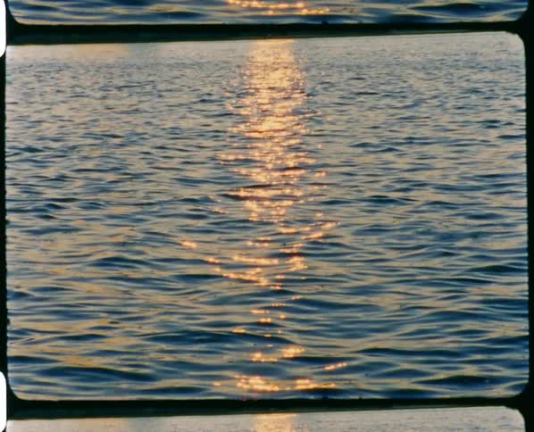 Water rippling with waves with reflection of sunlight on it