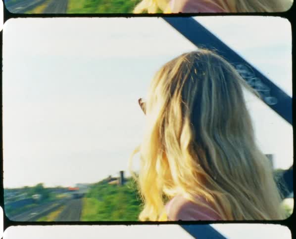 A woman walking out on a bridge