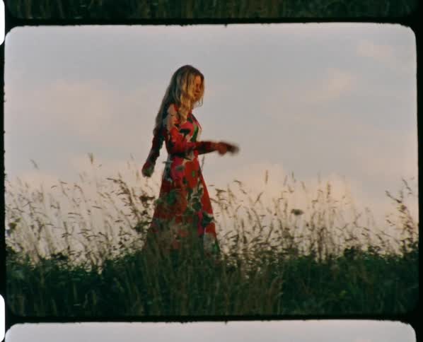 A woman walking out in a field