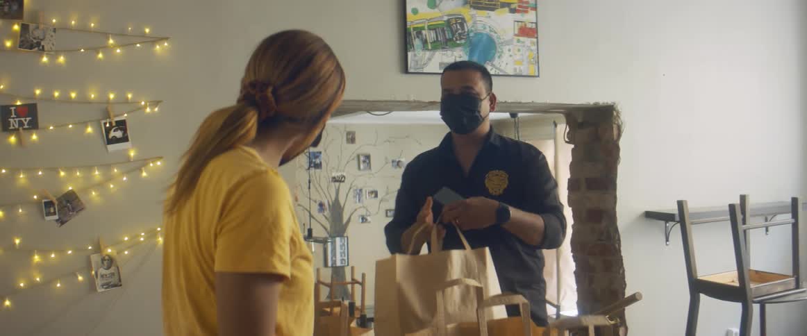 A woman putting out bags for someone else to deliver