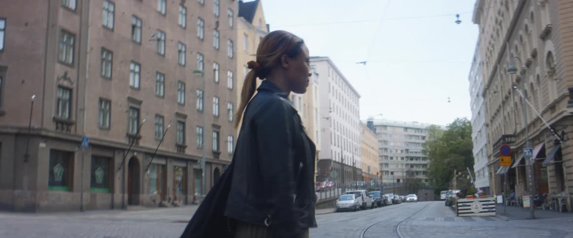 A woman walking around in a city