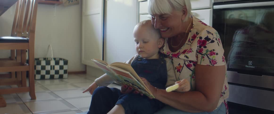 Woman reading baby book