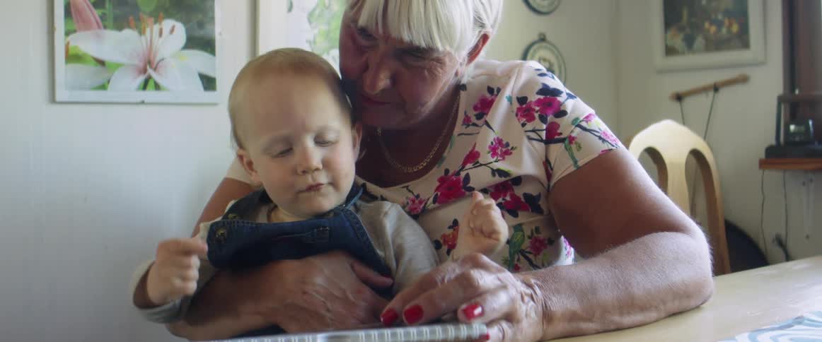 A grandmother and child reading