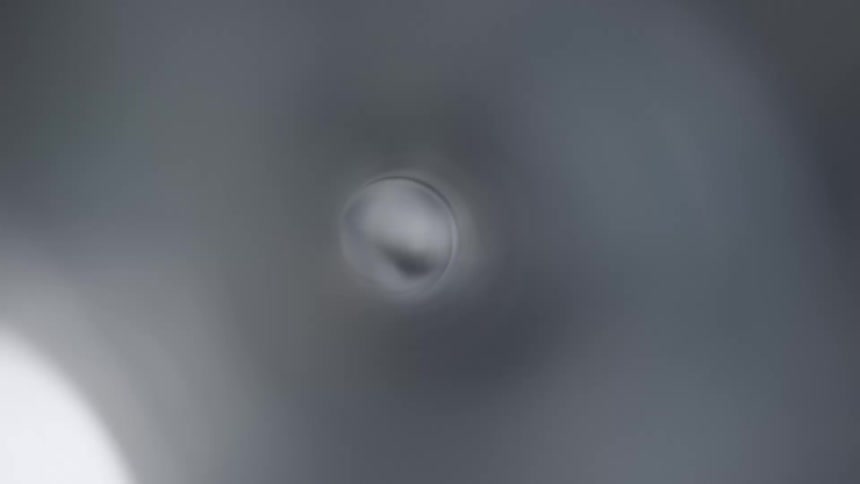 Close up of inside of a machine with some parts rotating very fast