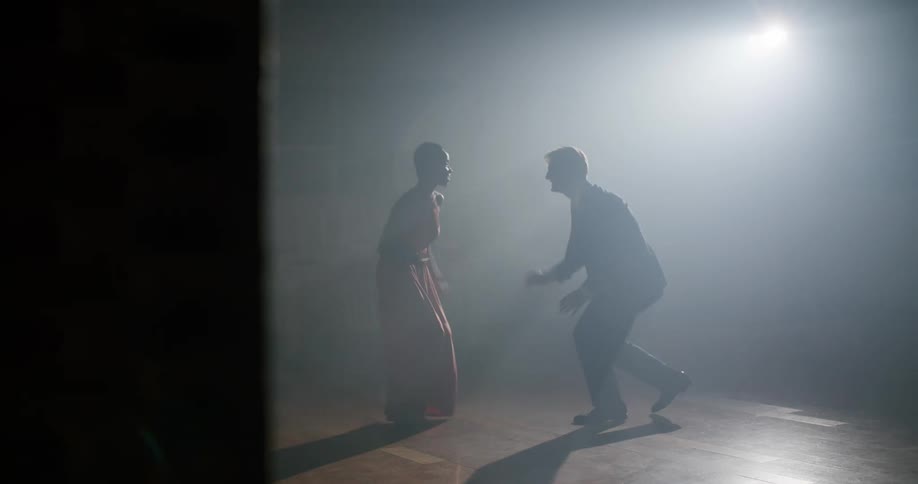 A view of a man and woman dancing on a stage