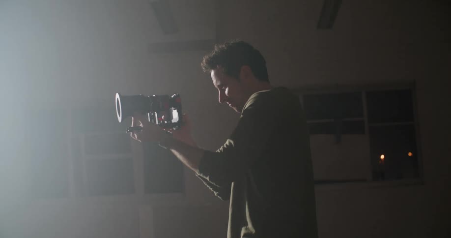 A man recording two people dancing