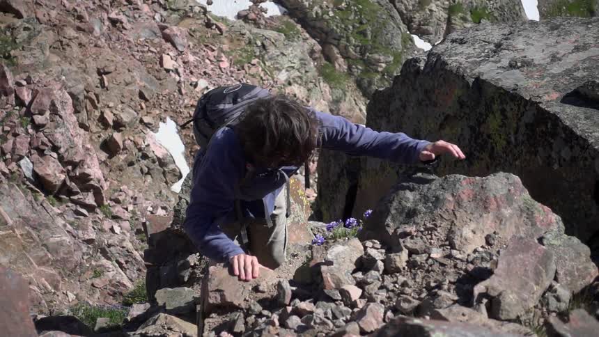 Person climbing some steep rocks