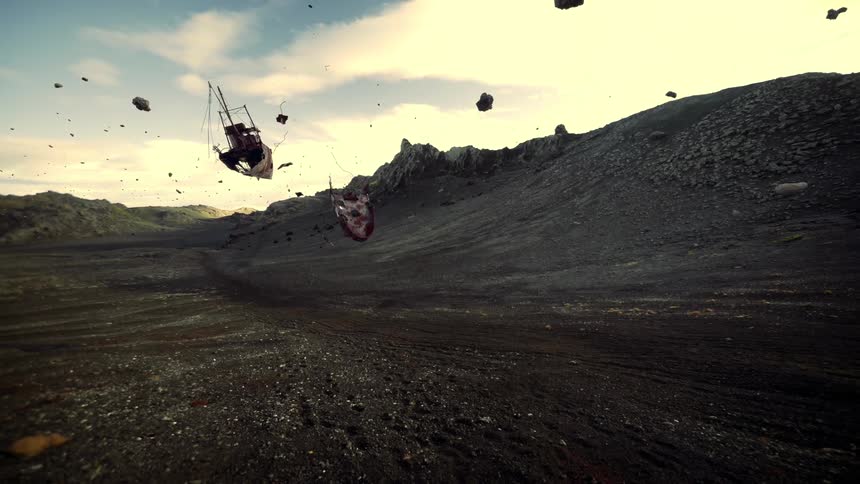 A landscape with debris with a mountain range the sky and clouds in the background