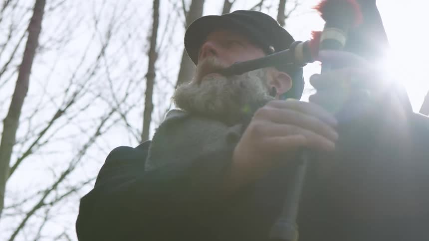 A man playing the bagpipes