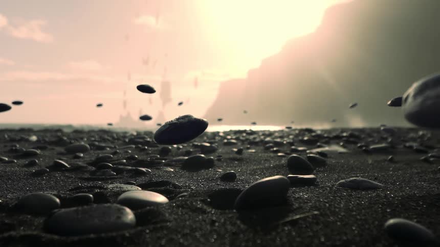 Rocks float from the sparkling sands of a beach into the air