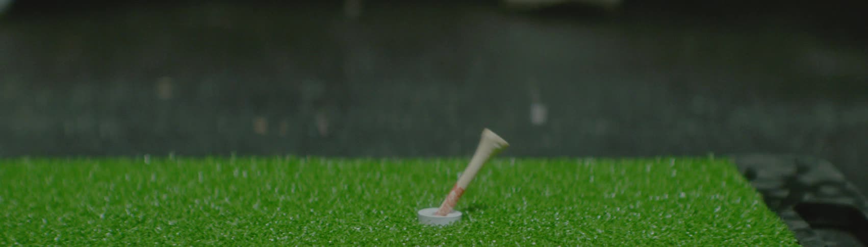 A close up of a golf ball being hit