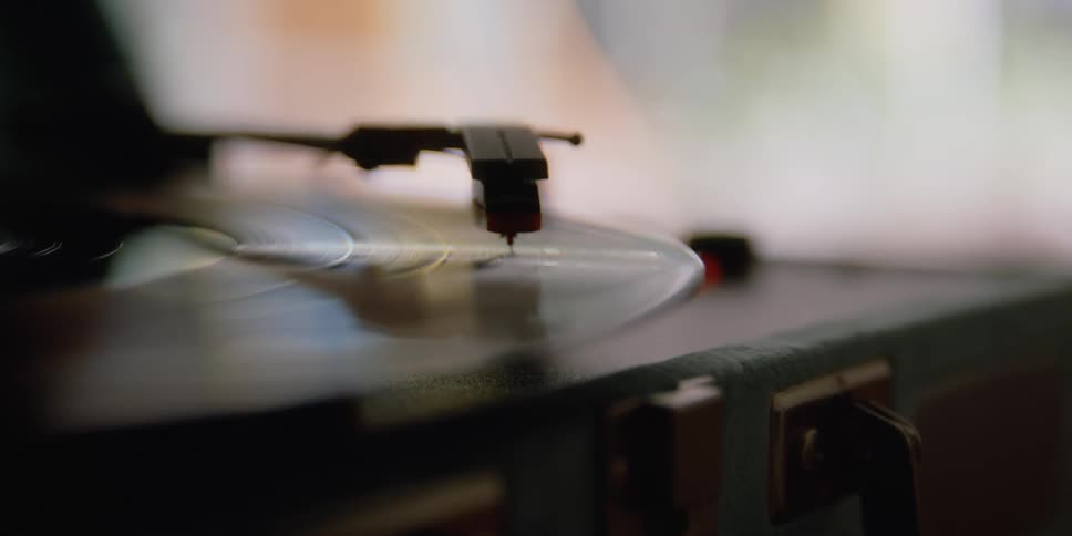 Vinyl record spining under the needle of a turntable