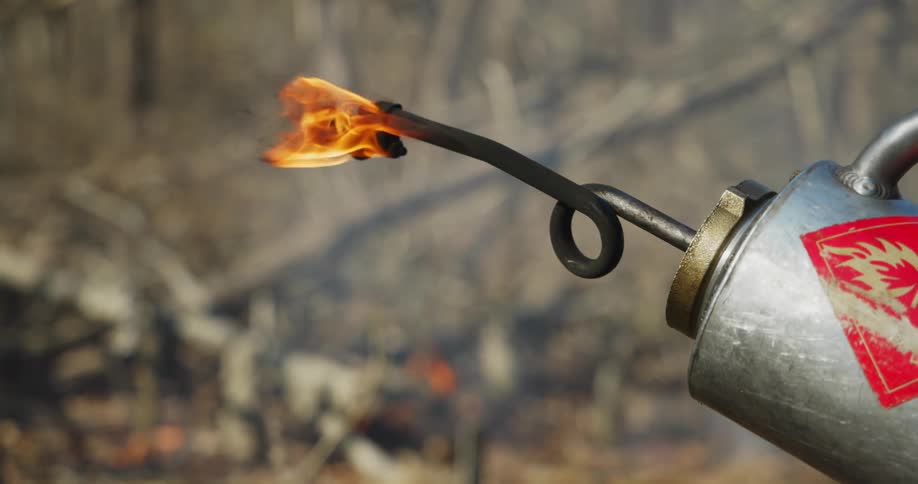 Close up of a flamethrower burning swiftly
