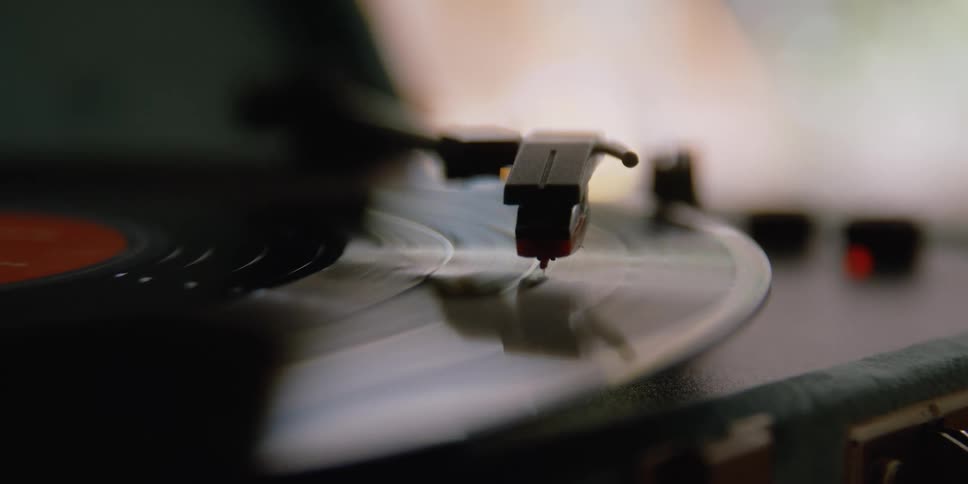 A close up of a vinyl on a record player