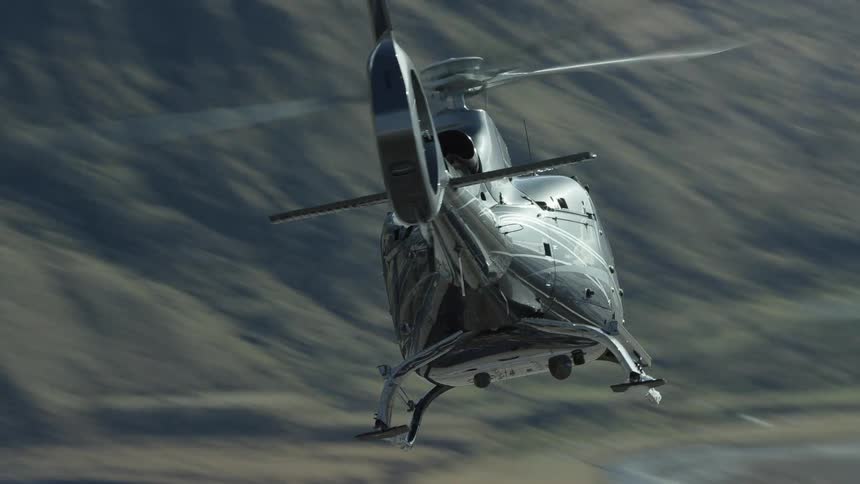 A view of a helicopter flying in a canyon