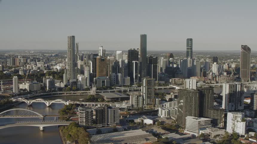 Skyscrapers and buildings in a city skyline with several bridges across a river