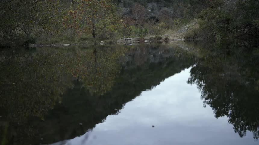 The water is calm and reflective