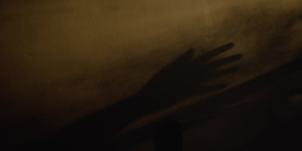 Shadow of hand on wall