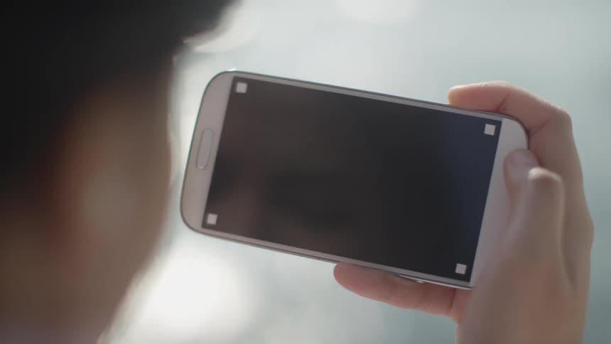 A view of a person looking at a smartphone