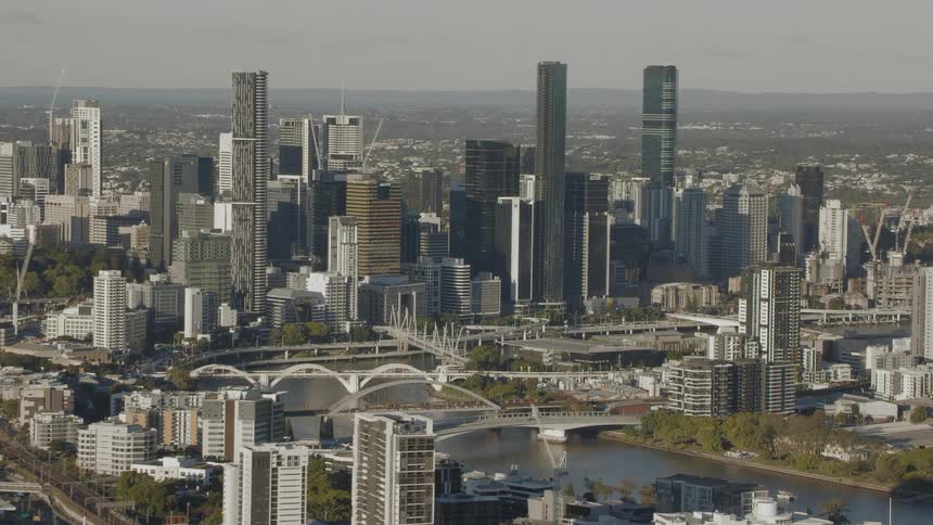 Aerial view moving closer to the downtown of a city with skyscrapers