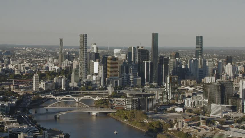 Skyscrapers on a riverfront in a metropolis during the day