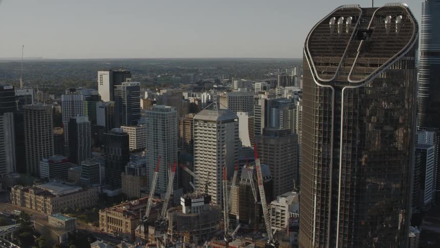 View from a helicopter flying past skyscrapers in the downtown area of a city in the daytime