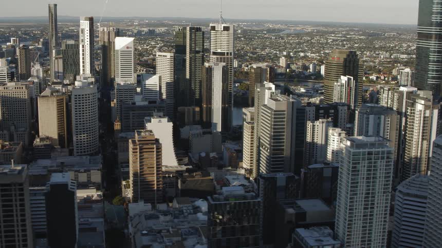High rise office buildings and condos of varying heights and materials fill a city skyline