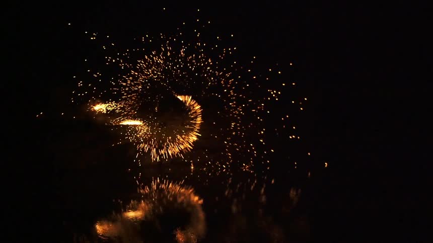 Sparks are flying in a circle in a dark area