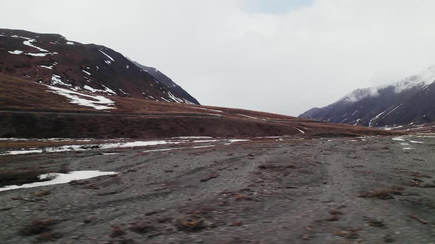 Snow is covering mountains in an arctic area