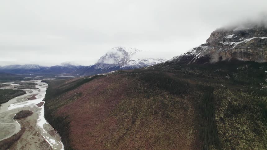 Aerial view of snow covered mountain peaks