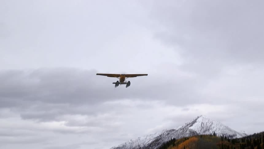 Water plane taking off on a cloudy day