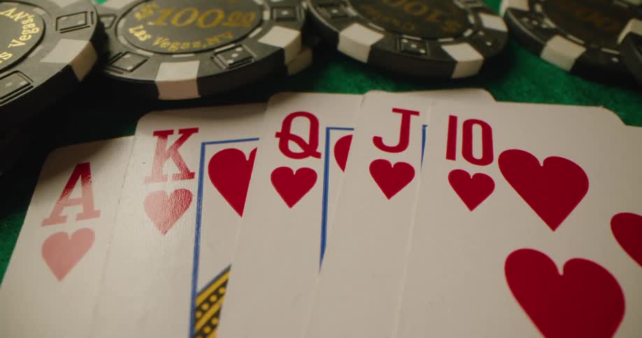 Cards on a table next to chips