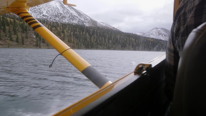 Moving fast over a lake on a cloudy day