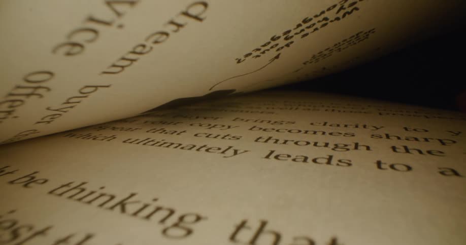 Book pages close in the center of a stack of pages