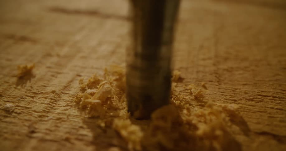 A drill drilling into wood