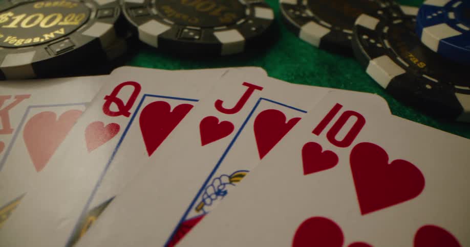 A close up of a table with cards and chips