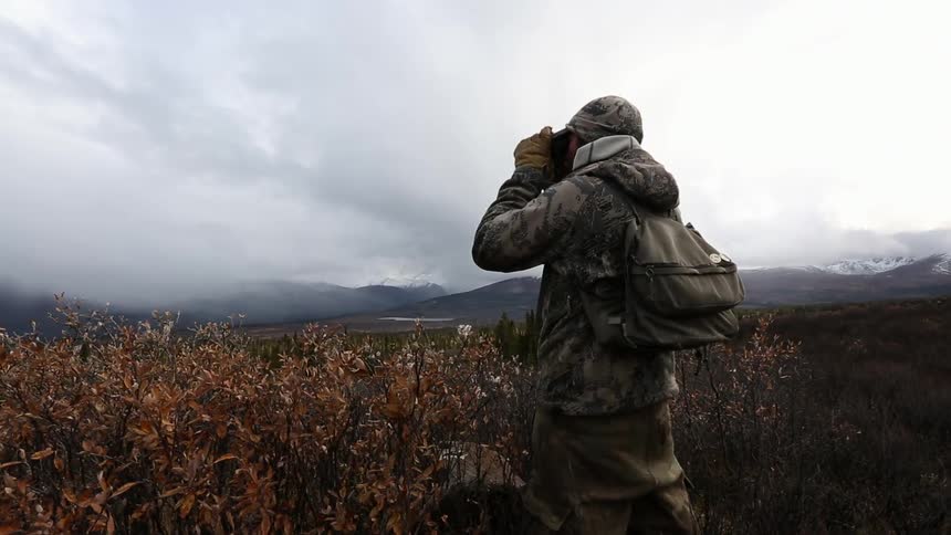 A person takes pictures on a cloudy day