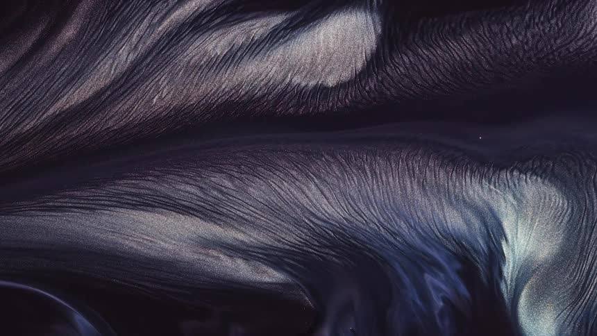 iridescent and shimmering colors form a stream of fluid