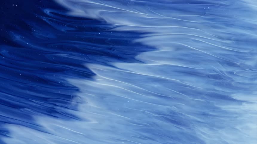 A close up of liquids changing color