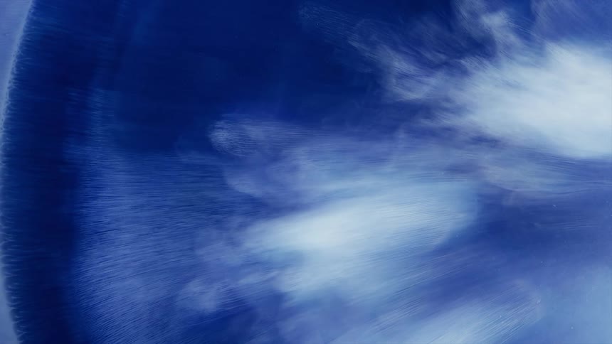 Blue and white artwork is painted to appear like clouds in the sky