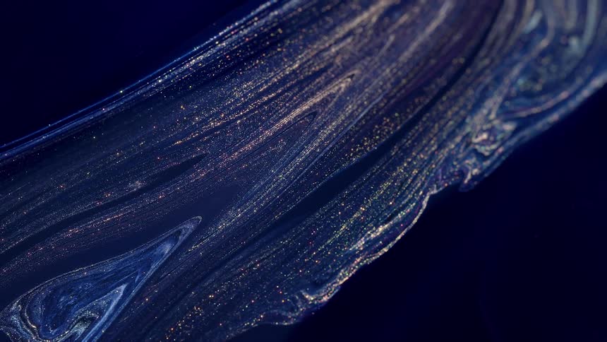 Abstract footage of colors flowing in a unique shape of golden and silver ink