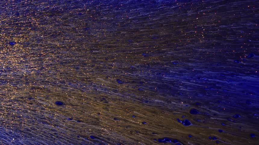 Metallic liquid puddles and moves in linear lines against a non moving background